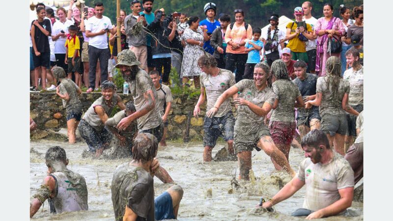 News Article: Foreign Tourists Enjoy Mud Play at Pokhara’s Asare Ropain Festival