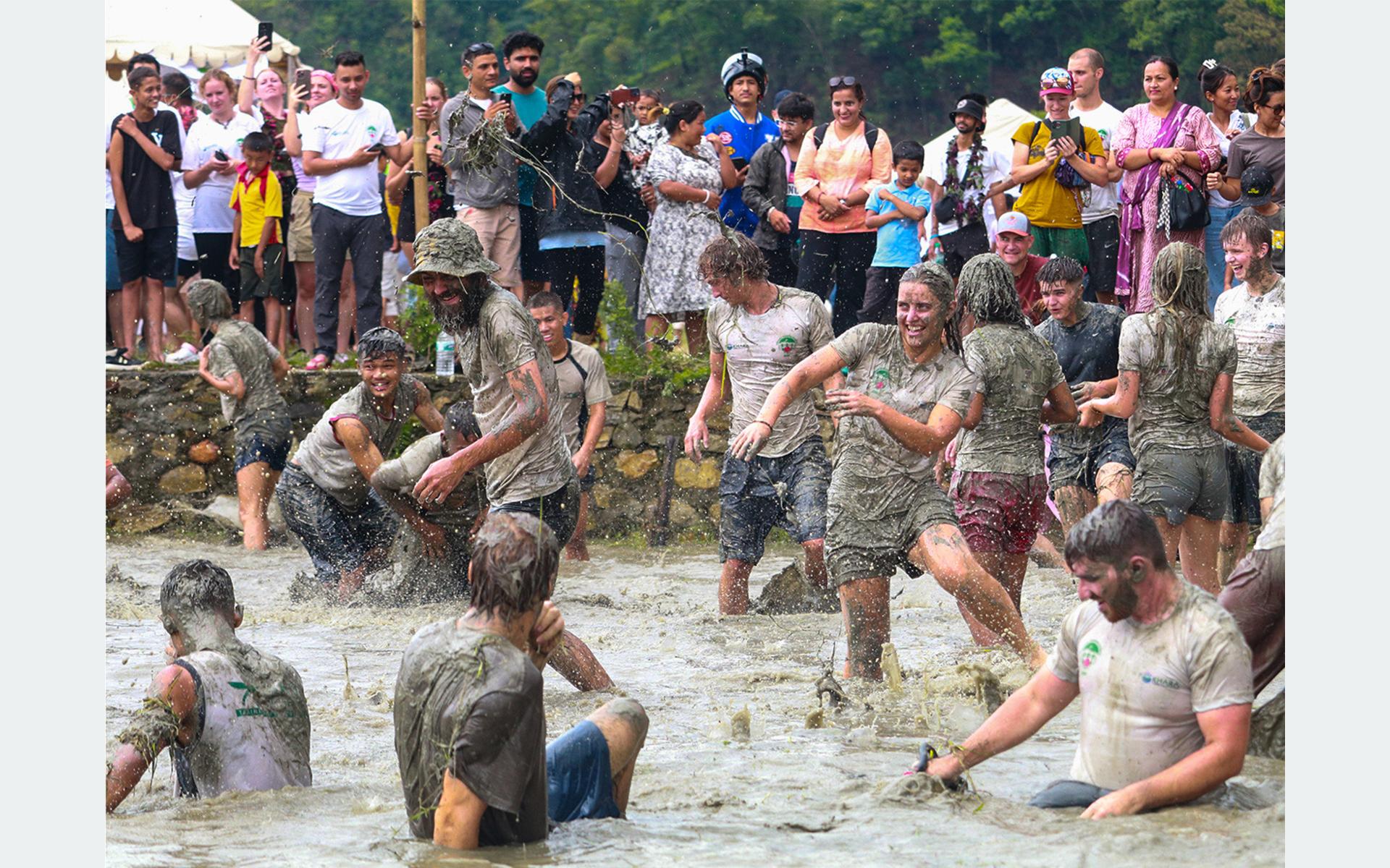 News Article: Foreign Tourists Enjoy Mud Play at Pokhara’s Asare Ropain Festival