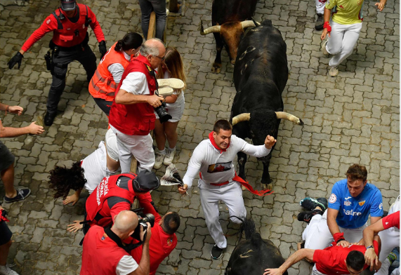 Exciting Fourth Bullrun at San Fermin Festival in Pamplona