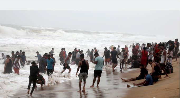 Nepali and Indian Tourists Enjoy the Sea at Famous Jagannath Puri Temple Area in Odisha