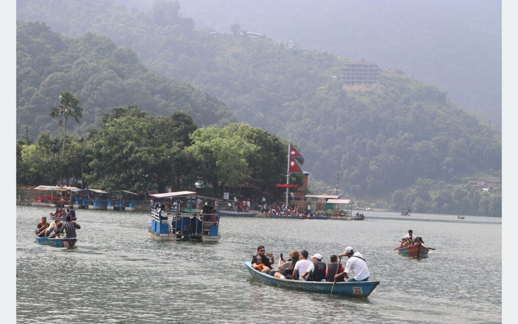 Tourists Enjoy Boating at Fewa Lake, a Ramsar Site in Pokhara