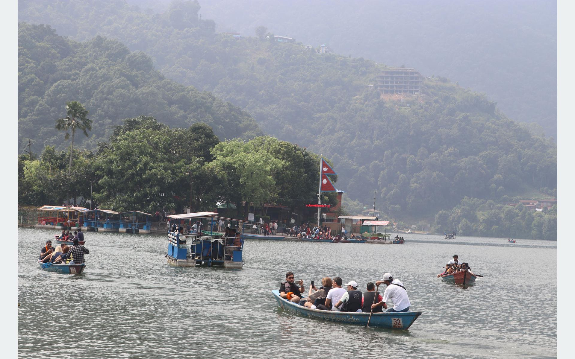 Tourists Enjoy Boating at Fewa Lake, a Ramsar Site in Pokhara